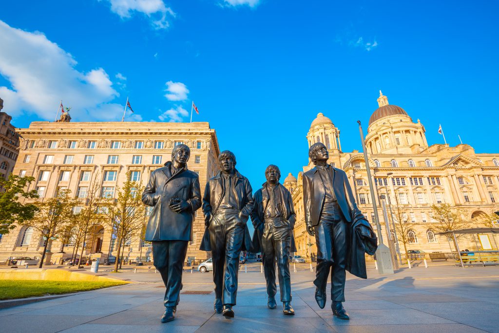 Liverpool, UK - May 17 2018: Bronze statue of the Beatles stand